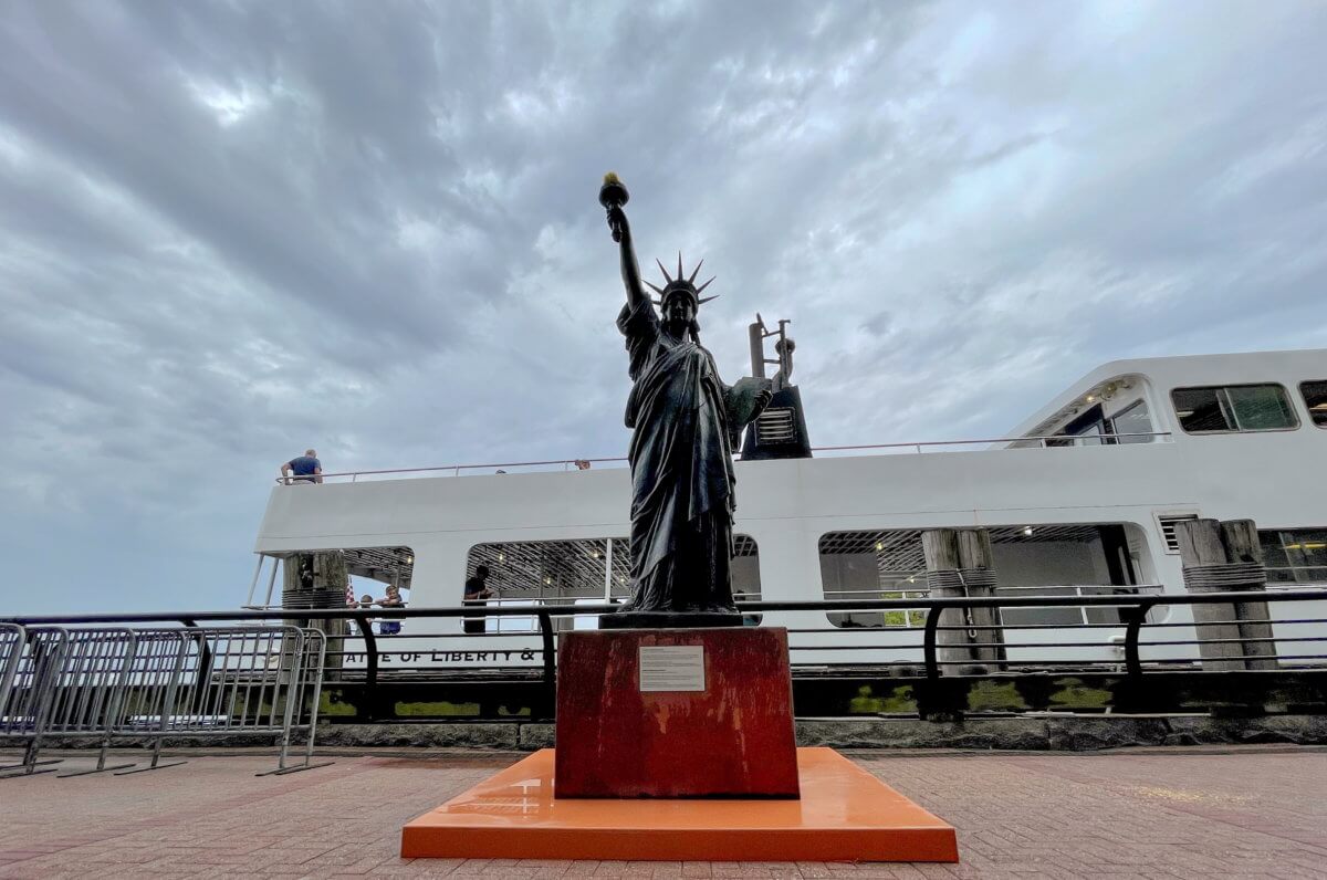 A replica Statue of Liberty is installed on Ellis Island across from her big sister in New York Harbor