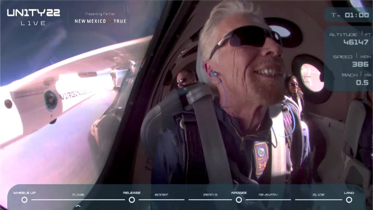 Billionaire Richard Branson smiles on board Virgin Galactic’s passenger rocket plane VSS Unity