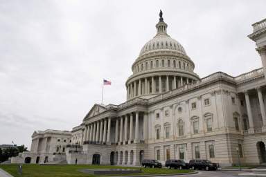FILE PHOTO: Vehicles are parked outside the U.S. Capitol building the morning the Senate returned to session in Washington