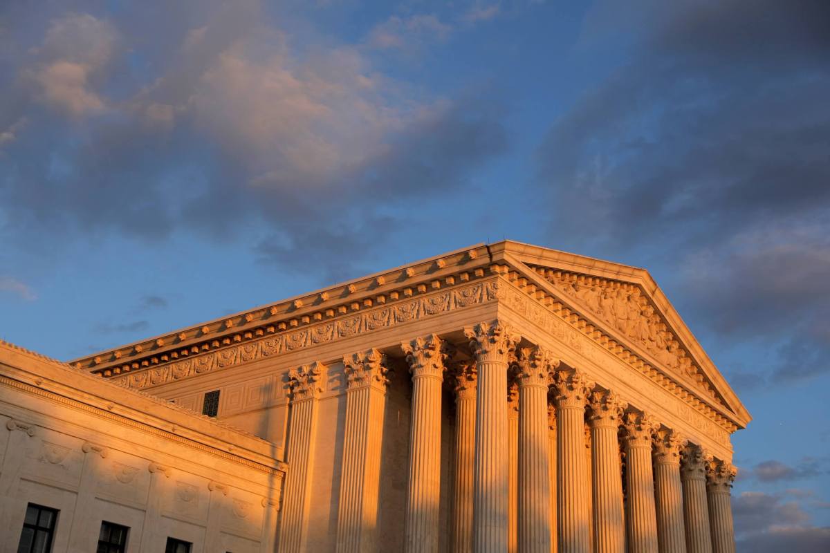 FILE PHOTO: Light from the sunset shines on the United States Supreme Court Building in Washington, D.C.