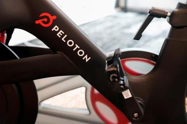 FILE PHOTO: A Peloton exercise bike is seen after the ringing of the opening bell for the company’s IPO at the Nasdaq Market site in New York City