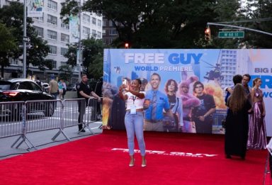 A guest takes a selfie on the red carpet at the premiere for the film “Free Guy” in New York