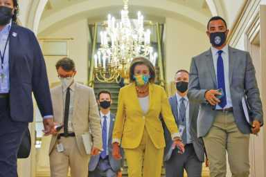 U.S. House Speaker Pelosi arrives for a House Democratic caucus meeting at the U.S. Capitol in Washington