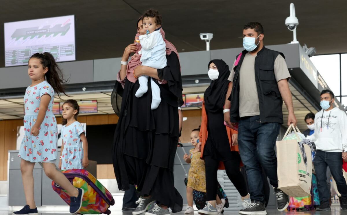 Afghan refugees arrive at Dulles Airport in Virginia