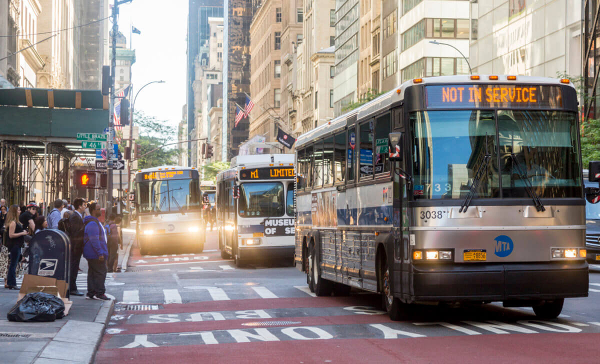Double wide red painted bus lanes at 5th Avenue, Manhattan
