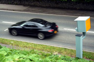 Sports Car Passing a Static Speed Camera
