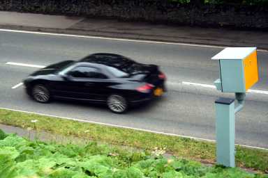 Sports Car Passing a Static Speed Camera