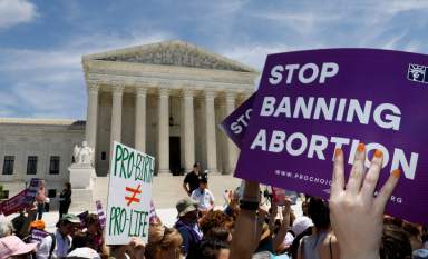 FILE PHOTO: Abortion rights activists rally outside the U.S. Supreme Court in Washington