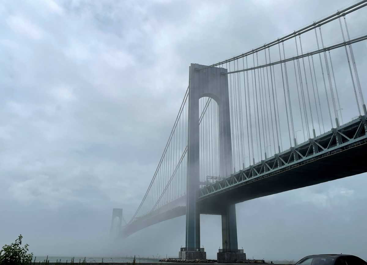 The Verrazzano-Narrows bridge is seen in morning fog, in New York City