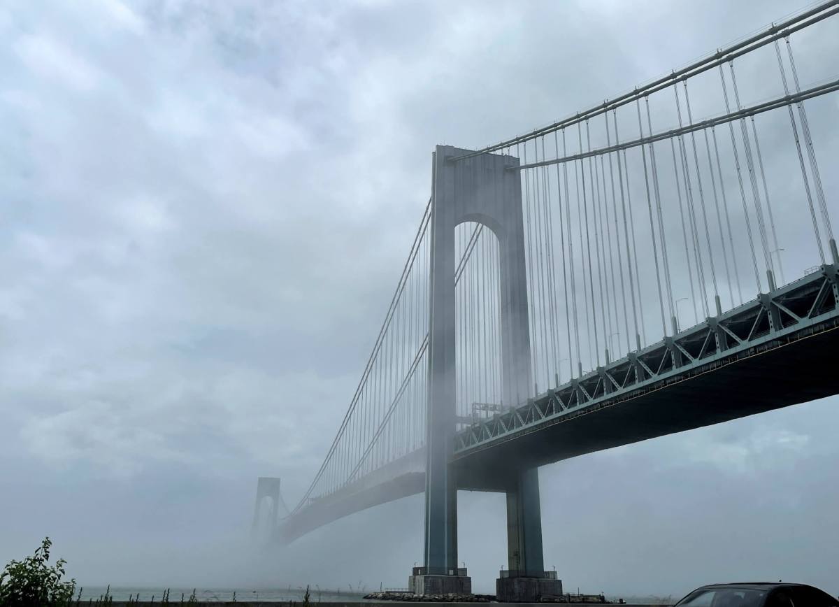 The Verrazzano-Narrows bridge is seen in morning fog, in New York City