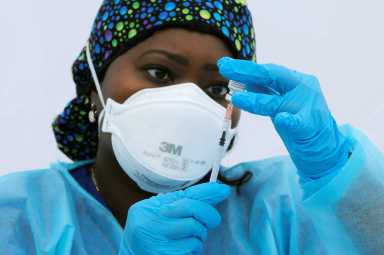 Coronavirus disease (COVID-19) vaccination event outside the Bronx Writing Academy school in New York City