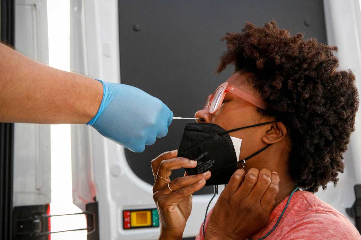 Akyiaa Wilson receives a coronavirus disease (COVID-19) test at a mobile testing van in New York
