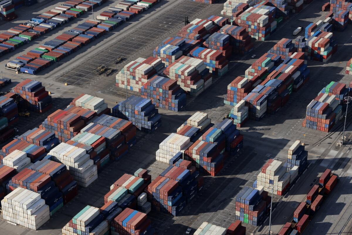 FILE PHOTO: Shipping containers sit on the dock at a container terminal at the Port of Long Beach-Port of Los Angeles complex, amid the coronavirus disease (COVID-19) pandemic, in Los Angeles