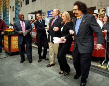 FILE PHOTO: Willard Scott and Gene Shalit dance with Meredith Vieira during her first day on NBC’s ‘Today’ show in New York