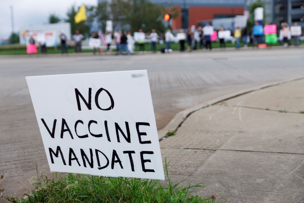 FILE PHOTO: People protest vaccine mandates at Summa Health Hospital in Ohio