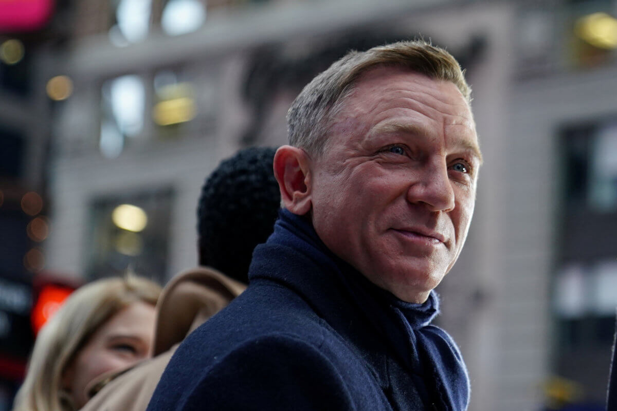 FILE PHOTO: Actor Daniel Craig reacts during a promotional appearance on TV in Times Square for the new James Bond movie “No Time to Die
