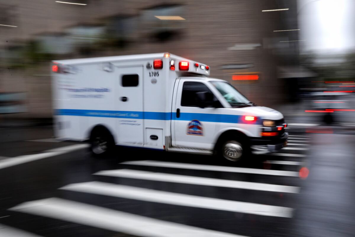 FILE PHOTO: An ambulance arrives at Mount Sinai Hospital in Manhattan during outbreak of coronavirus disease (COVID-19) in New York