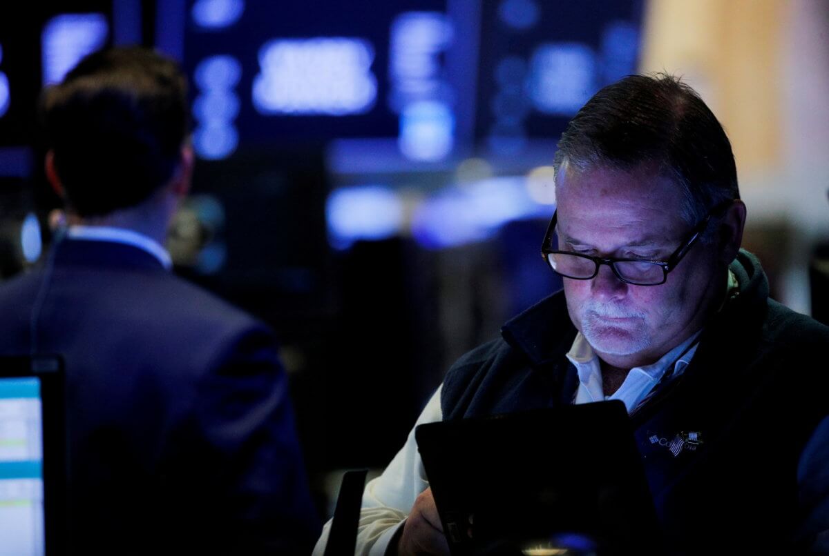 Traders work on the floor of the New York Stock Exchange (NYSE) in New York City