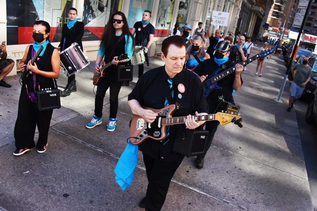 Patrick Grant leading “Tilted Axes” up Astor Place