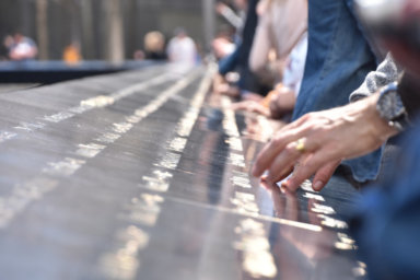 National September 11 Memorial in Manhattan, People touch the names of loved ones