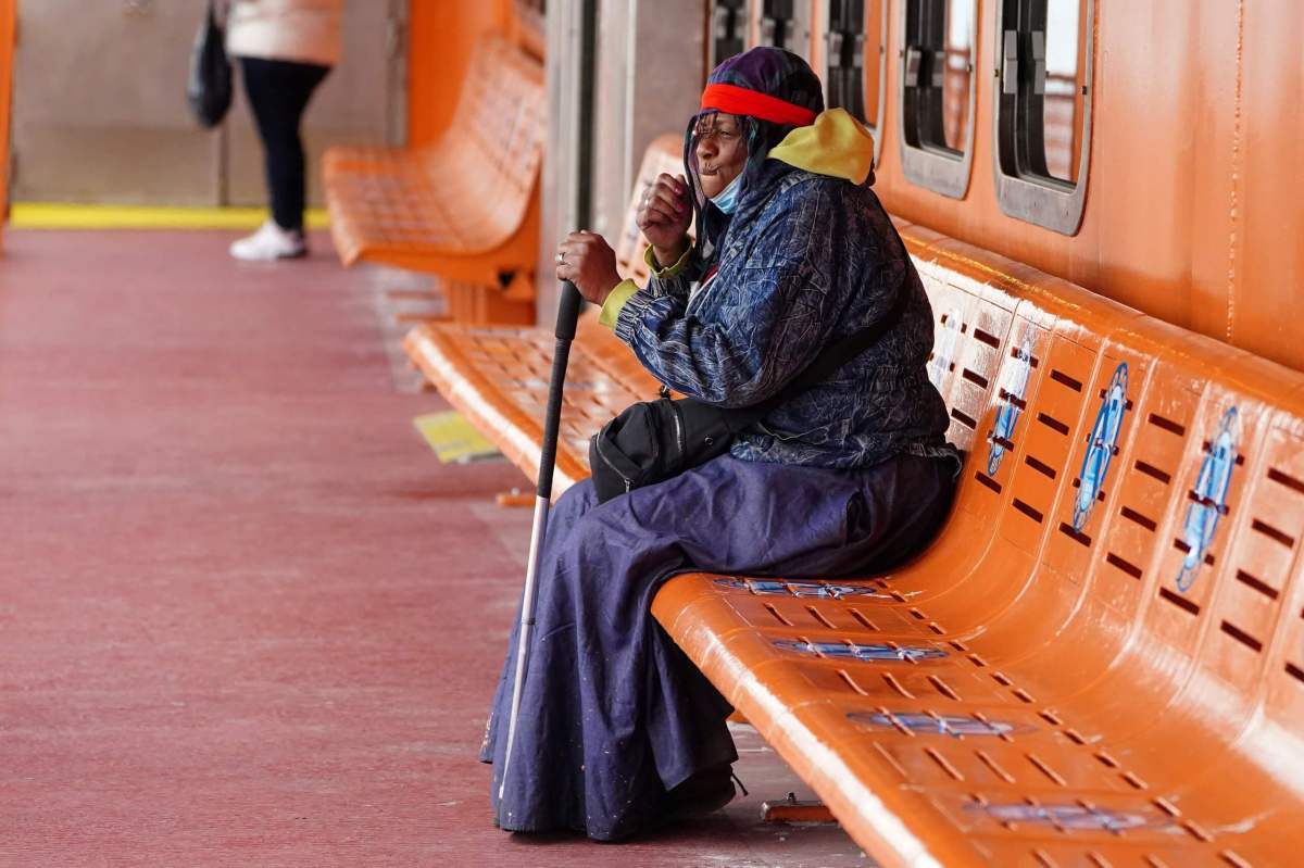 A woman sings as she rides the Staten Island Ferry in New York City