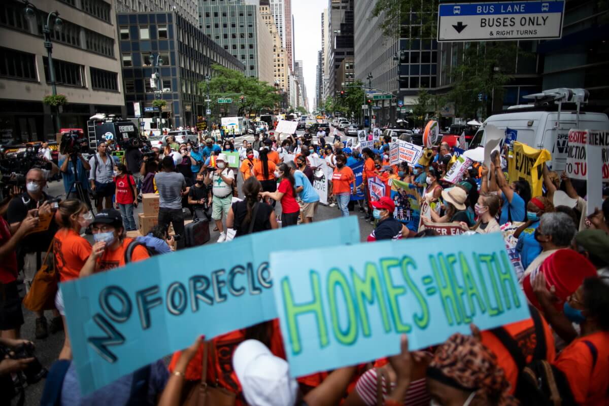 People take part in a protest to get rent relief or rent freeze in New York