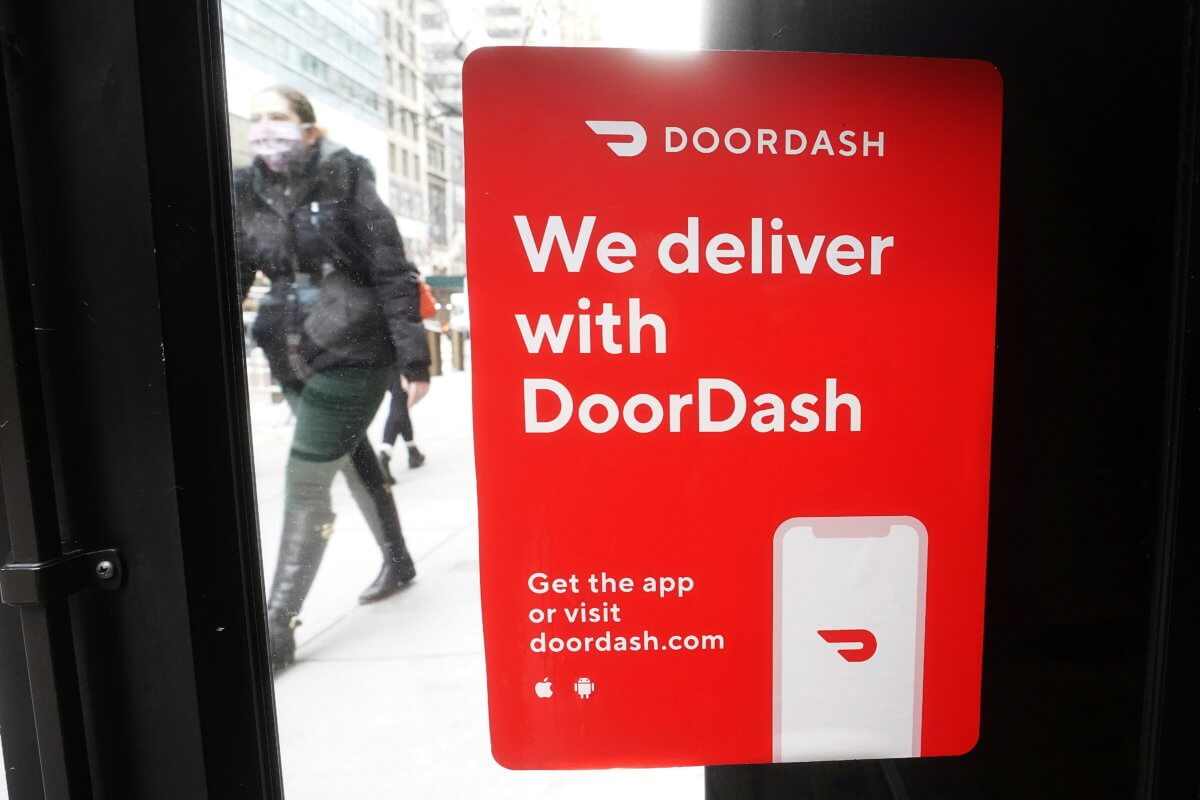 FILE PHOTO: A DoorDash sign is pictured on a restaurant on the day they hold their IPO