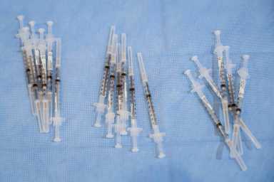 FILE PHOTO: Syringes filled with a doses of Pfizer’s coronavirus disease (COVID-19) vaccine are seen at a pop-up community vaccination center at the Gateway World Christian Center in Valley Stream, New York