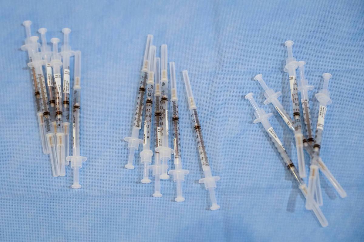 FILE PHOTO: Syringes filled with a doses of Pfizer’s coronavirus disease (COVID-19) vaccine are seen at a pop-up community vaccination center at the Gateway World Christian Center in Valley Stream, New York