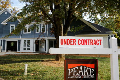 FILE PHOTO: A real estate sign advertising a home “Under Contract” is pictured in Vienna, Virginia