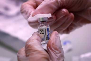 People receive vaccinations for the coronavirus disease (COVID-19) at subway station in Queens borough of New York City