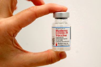 FILE PHOTO: A healthcare worker holds a vial of the Moderna COVID-19 vaccine in New York City