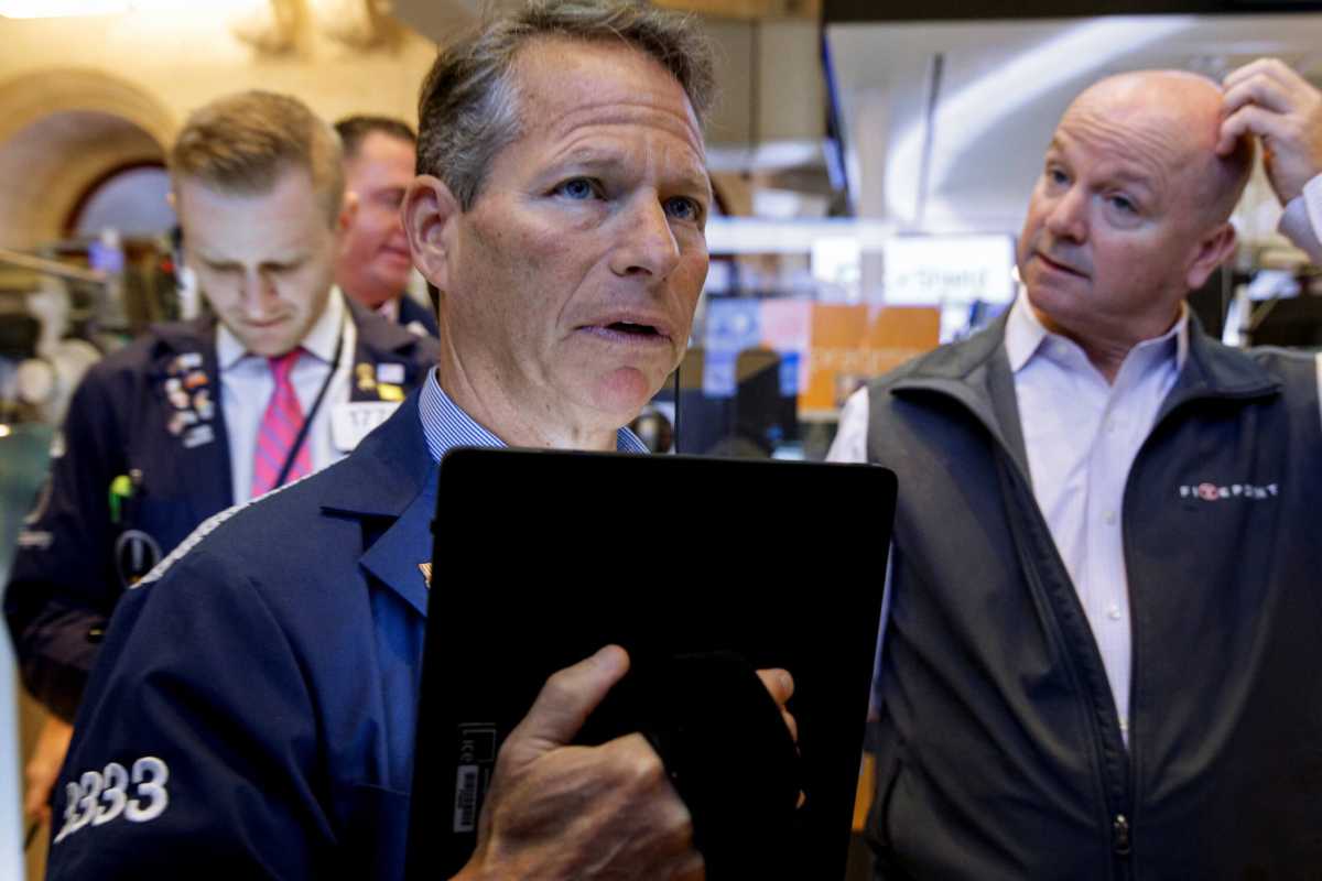 Traders work on the floor of the NYSE in New York