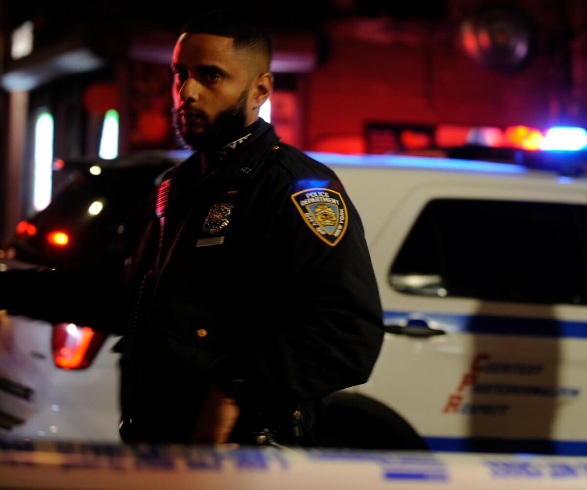 Police personnel respond to a shooting in the Brooklyn borough of New York