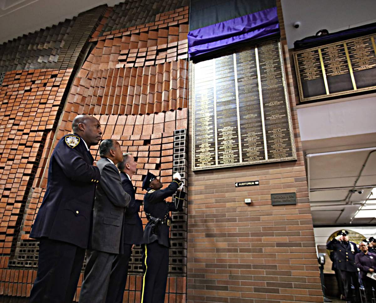 The plaque is unveiled
