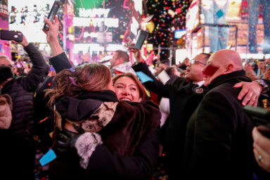 Two women embrace as they celebrate the New Year in  New York