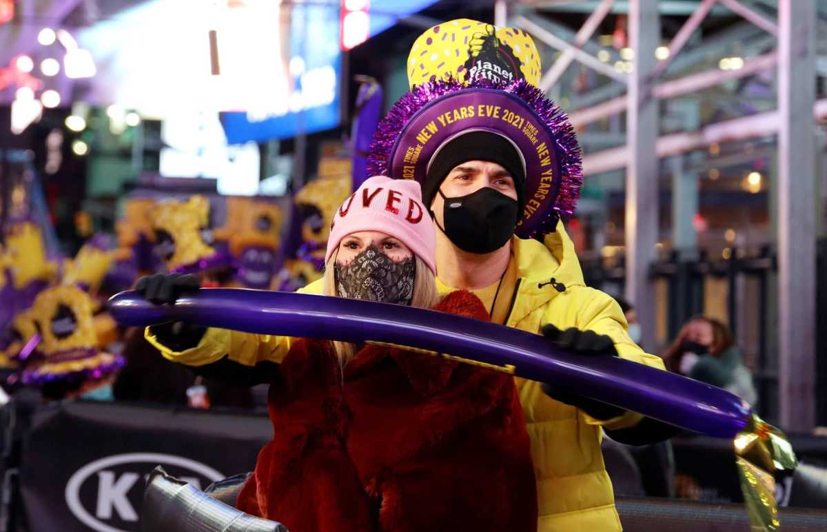 Revelers watch the performance in Times Square on New Years Eve in New York City
