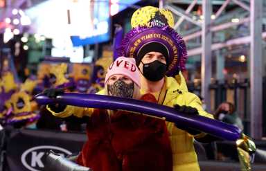 Revelers watch the performance in Times Square on New Years Eve in New York City