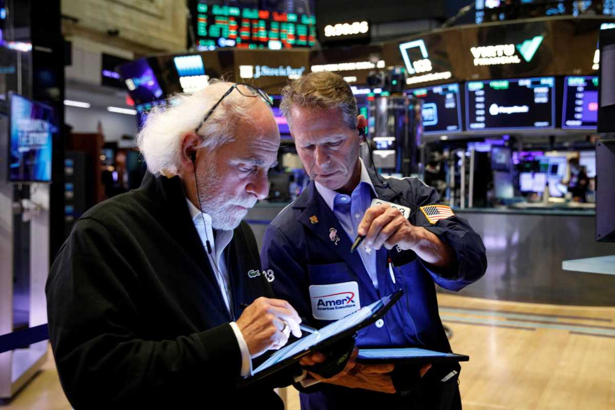 Traders work on the floor of the NYSE in New York