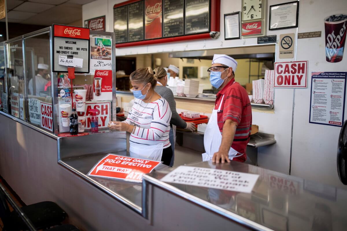 FILE PHOTO: Restaurant workers inside one of the city’s most popular restaurants in El Paso