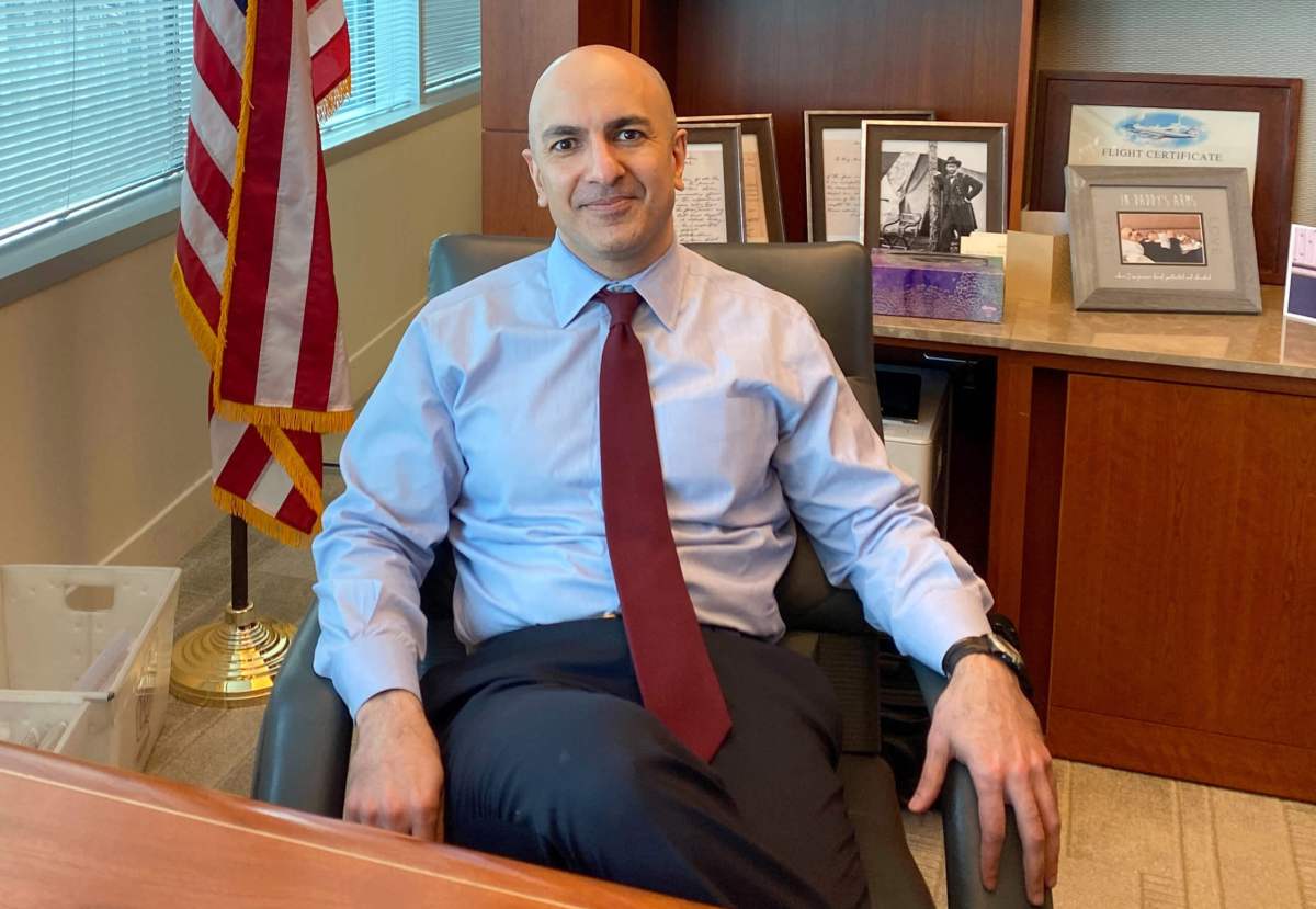 Minneapolis Federal Reserve Bank President Neel Kashkari poses during an interview with Reuters in his office at the bank’s headquarters in Minneapolis