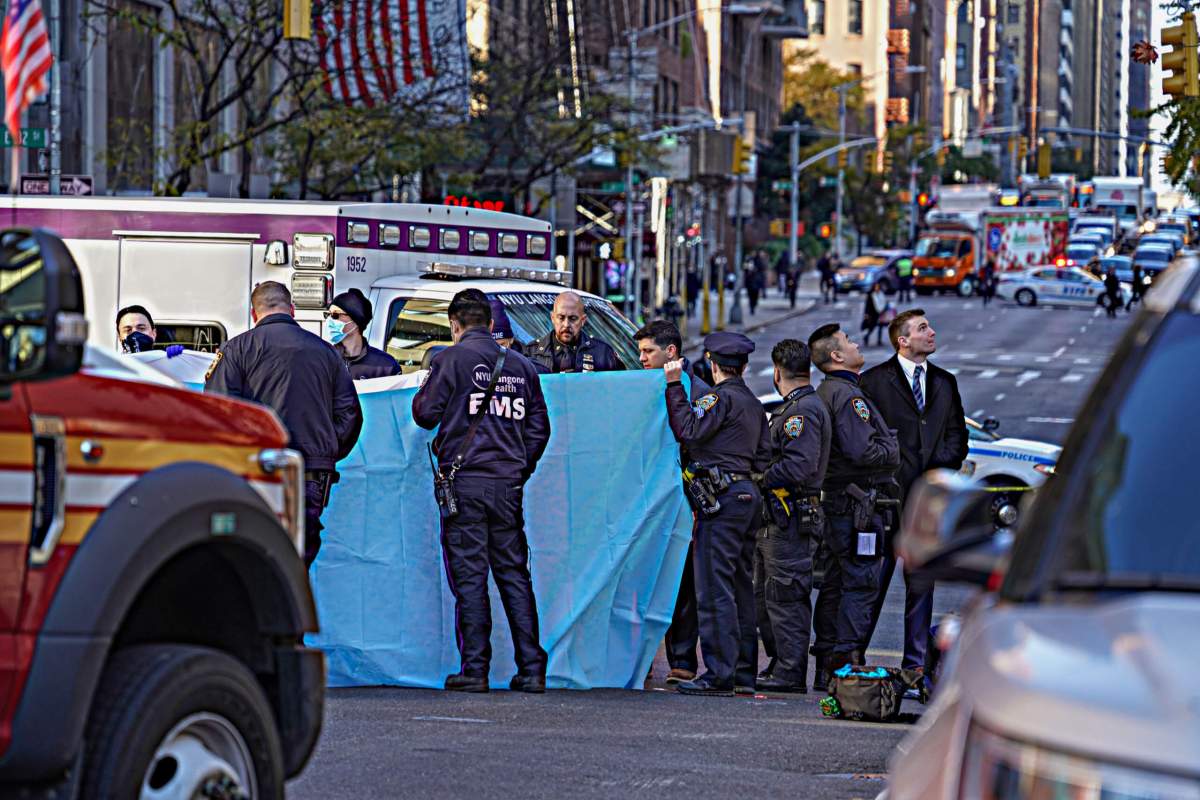 Officers remove the body
