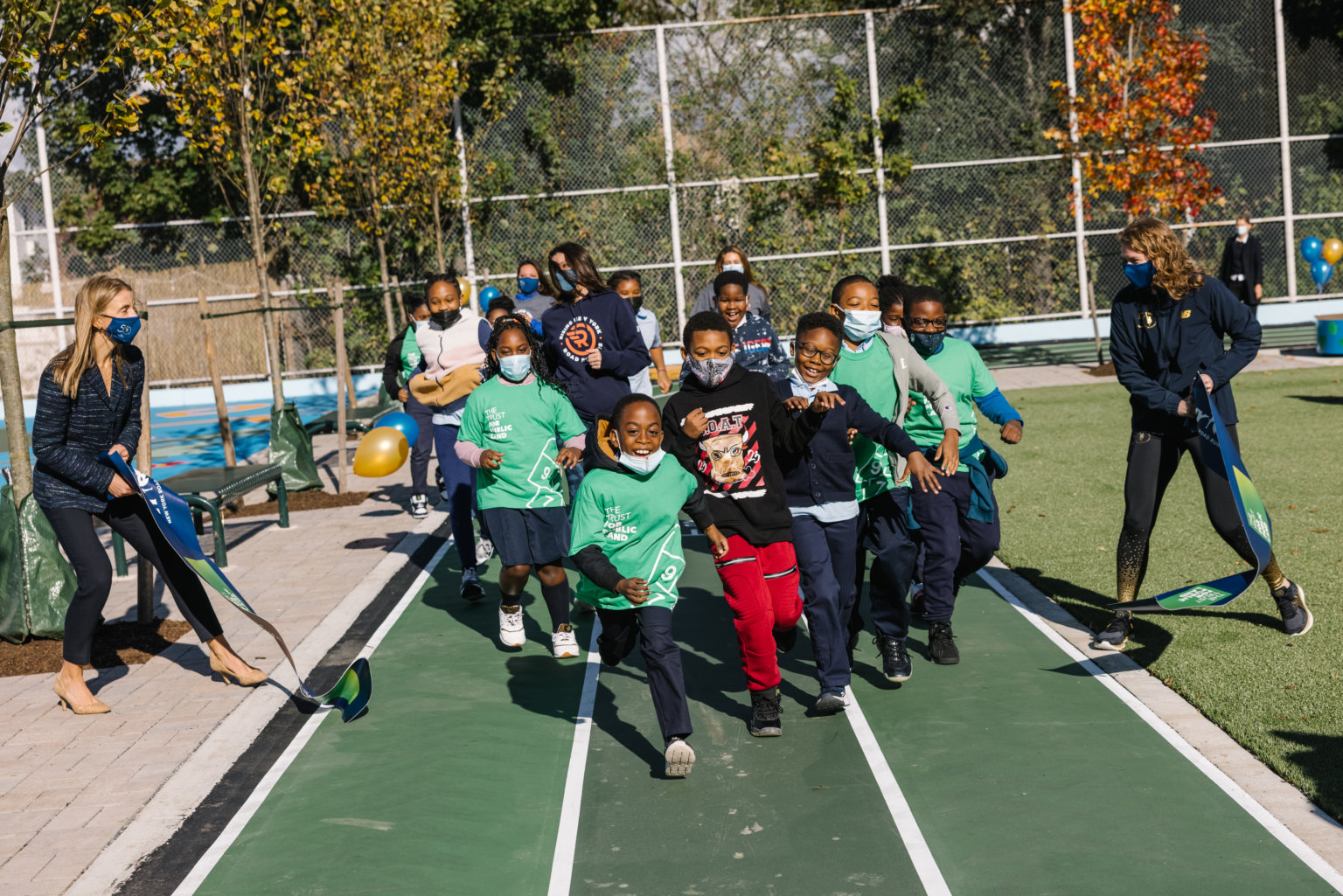 NYRR and The Trust for Public Land open P.S. 223Q Community Schoolyard amNewYork