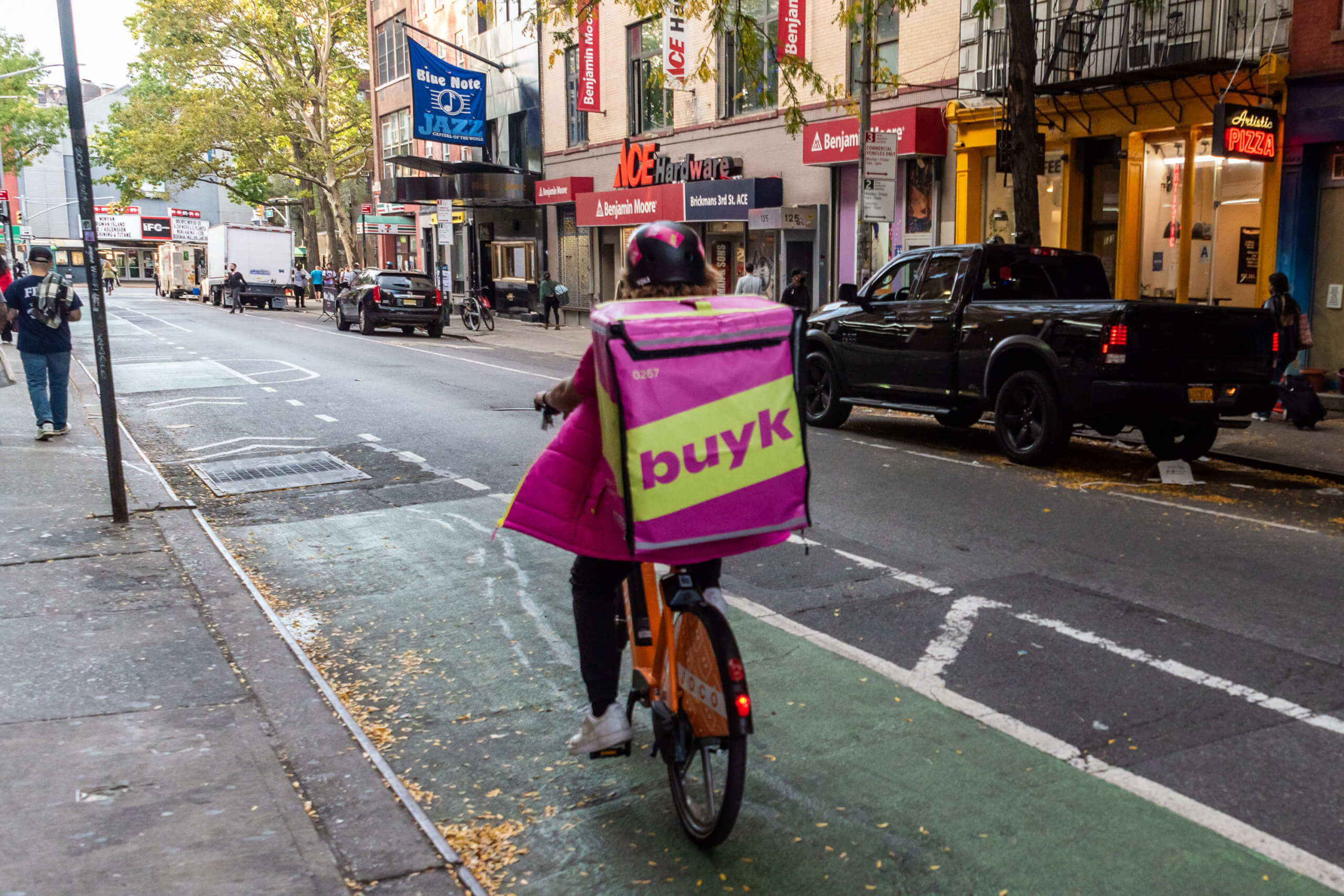 grocery delivery person on a bike