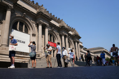 People line up to attend The Metropolitan Museum of Art on their first day open since closing due to the coronavirus disease (COVID-19) outbreak