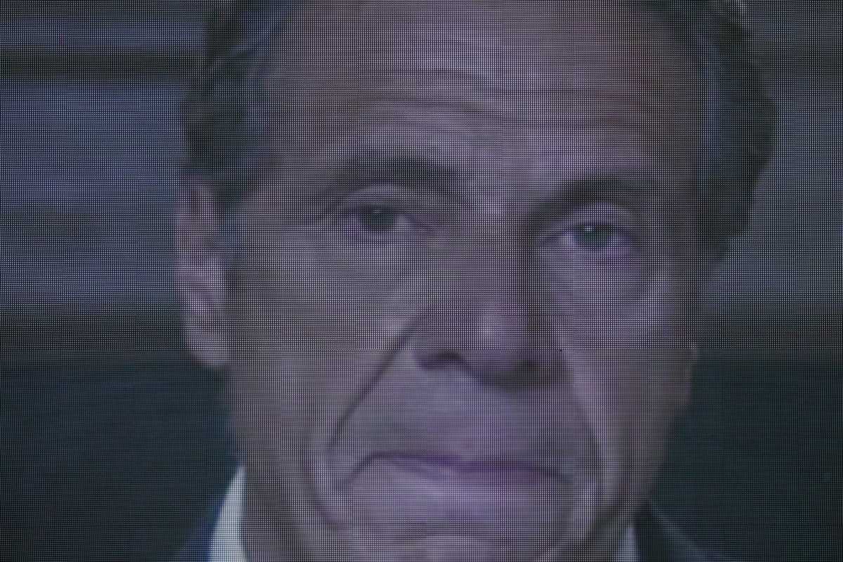 A farewell speech by New York Governor Andrew Cuomo is broadcast live on a screen in Times Square on his final day in office in Manhattan, New York City