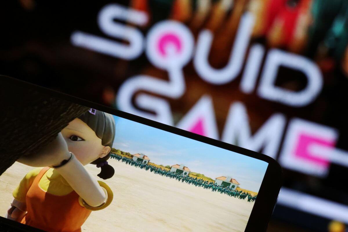 The Netflix series “Squid Game” is played on a mobile phone in this picture illustration