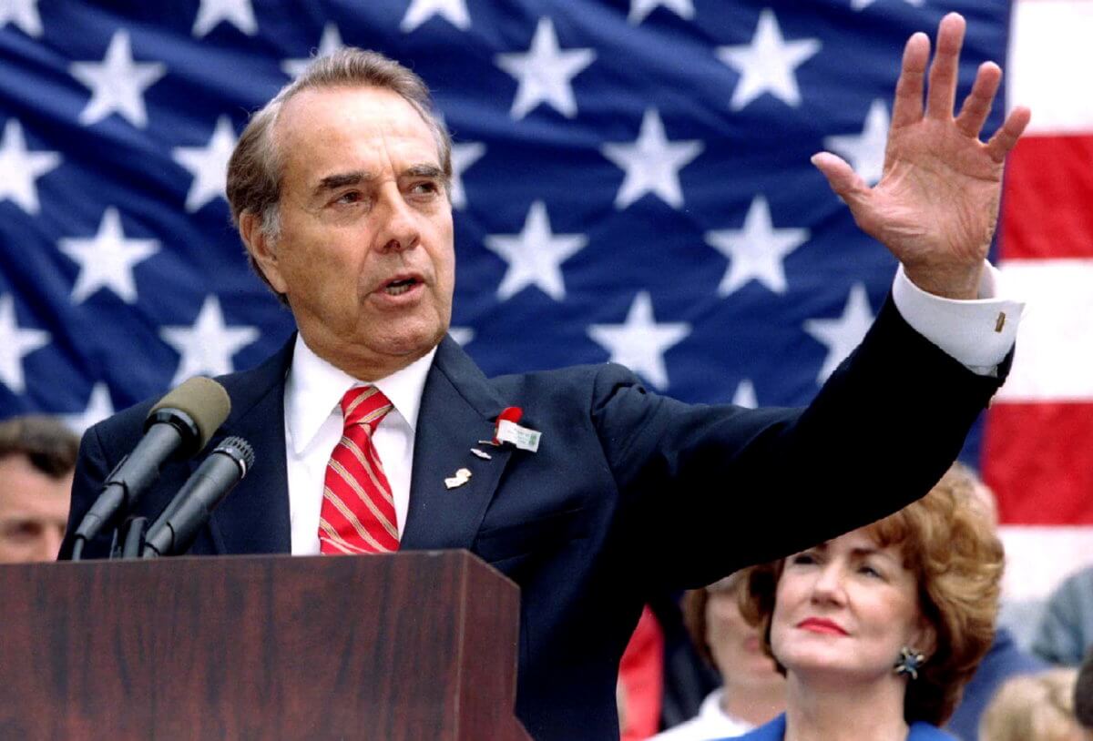 FILE PHOTO: Republican presidential candidate Bob Dole makes a point during a Memorial Day speech in Clifton
