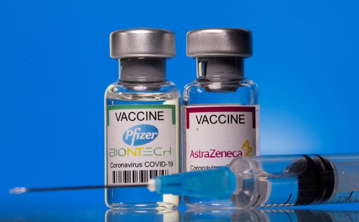 FILE PHOTO: FILE PHOTO: Picture illustration of vials with Pfizer-BioNTech and AstraZeneca coronavirus disease (COVID-19) vaccine labels