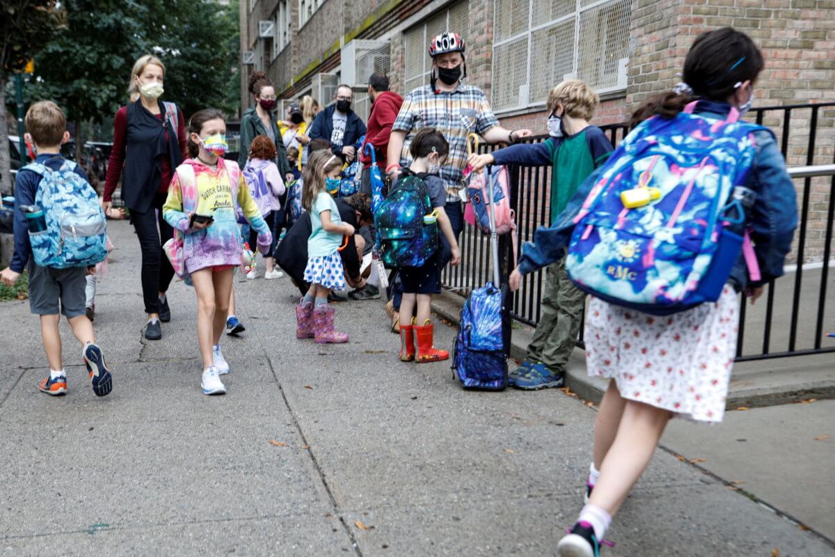 Children arrive at school, amid the coronavirus disease (COVID-19) pandemic in Brooklyn, New York